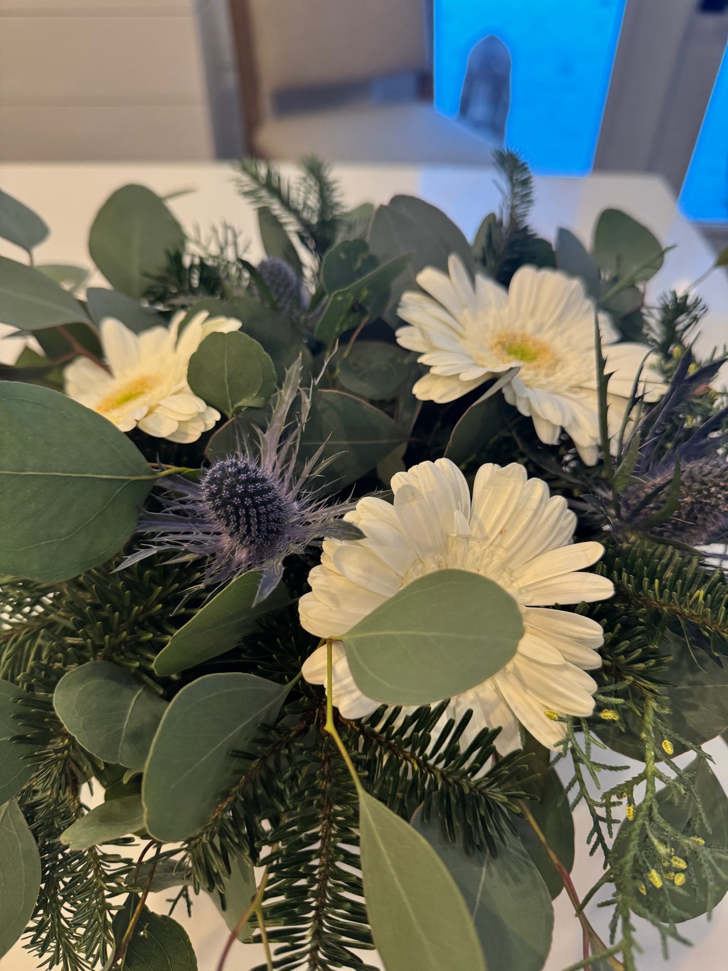 White Gerbers Daisies and Purple Thistle Arrangement